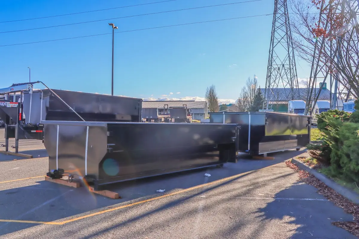 Roll-off dumpster ready for waste disposal at job site for Concrete Dumpster Rental in Fort Walton Beach